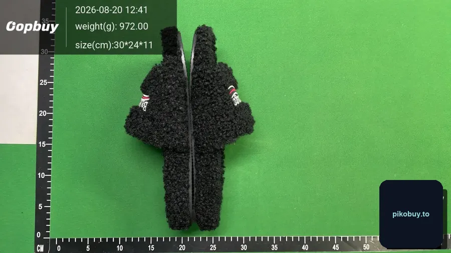 Warehouse QC photo of a balenciaga fur slides order